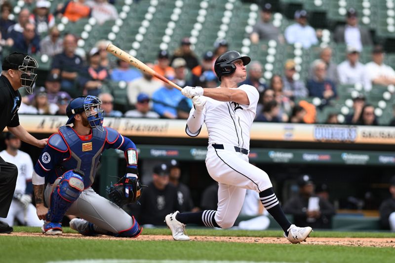 Apr 18, 2024; Detroit, Michigan, USA;  Detroit Tigers designated hitter Kerry Carpenter (30) hits a triple against the Texas Rangers in the fourth inning at Comerica Park. Mandatory Credit: Lon Horwedel-USA TODAY Sports