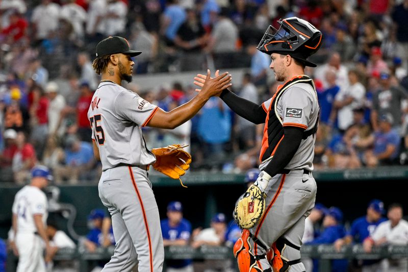 Jun 8, 2024; Arlington, Texas, USA; San Francisco Giants relief pitcher Camilo Doval (75) and catcher Patrick Bailey (14) celebrate the Giants victory over the Texas Rangers at Globe Life Field. Mandatory Credit: Jerome Miron-USA TODAY Sports