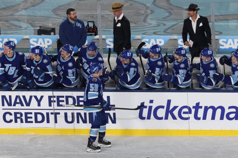 Feb 1, 2026; Tampa Bay, Florida, USA; Tampa Bay Lightning center Jake Guentzel (59) is congratulated by the bench after scoring a goal against the Boston Bruins during a shootout in the 2026 Stadium Series ice hockey game at Raymond James Stadium. Mandatory Credit: Nathan Ray Seebeck-Imagn Images