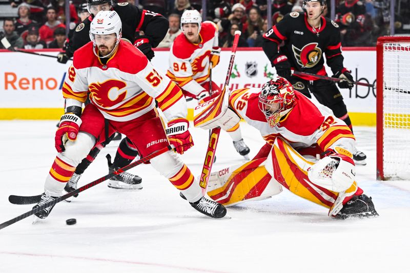 Nov 25, 2024; Ottawa, Ontario, CAN; Calgary Flames goalie Dustin Wolf (32) tracks the puck against the Ottawa Senators during the third period at Canadian Tire Centre. Mandatory Credit: David Kirouac-Imagn Images