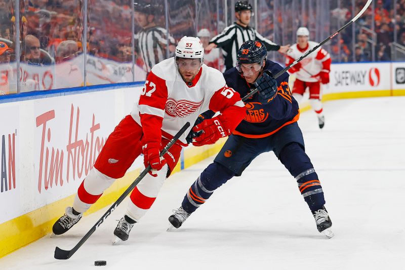 Feb 15, 2023; Edmonton, Alberta, CAN; Detroit Red Wings forward David Perron (57) protects the puck from Edmonton Oilers forward Ryan Nugent-Hopkins (93) during the second period at Rogers Place. Mandatory Credit: Perry Nelson-USA TODAY Sports