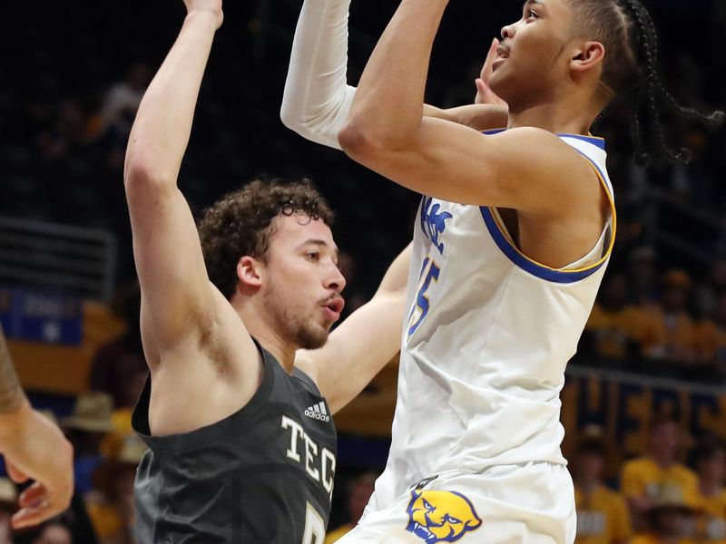 Feb 25, 2025; Pittsburgh, Pennsylvania, USA;  Pittsburgh Panthers guard Jaland Lowe (15) shoots against Georgia Tech Yellow Jackets guard Lance Terry (0) during the second half at the Petersen Events Center. Mandatory Credit: Charles LeClaire-Imagn Images