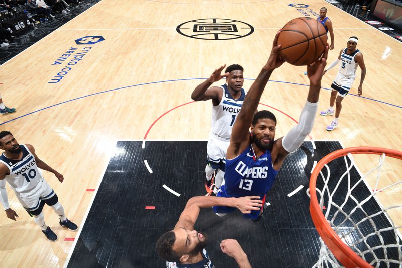 LOS ANGELES, CA - FEBRUARY 28: Paul George #13 of the LA Clippers drives to the basket during the game against the Minnesota Timberwolves on February 28, 2023 at Crypto.Com Arena in Los Angeles, California. NOTE TO USER: User expressly acknowledges and agrees that, by downloading and/or using this Photograph, user is consenting to the terms and conditions of the Getty Images License Agreement. Mandatory Copyright Notice: Copyright 2023 NBAE (Photo by Adam Pantozzi/NBAE via Getty Images)