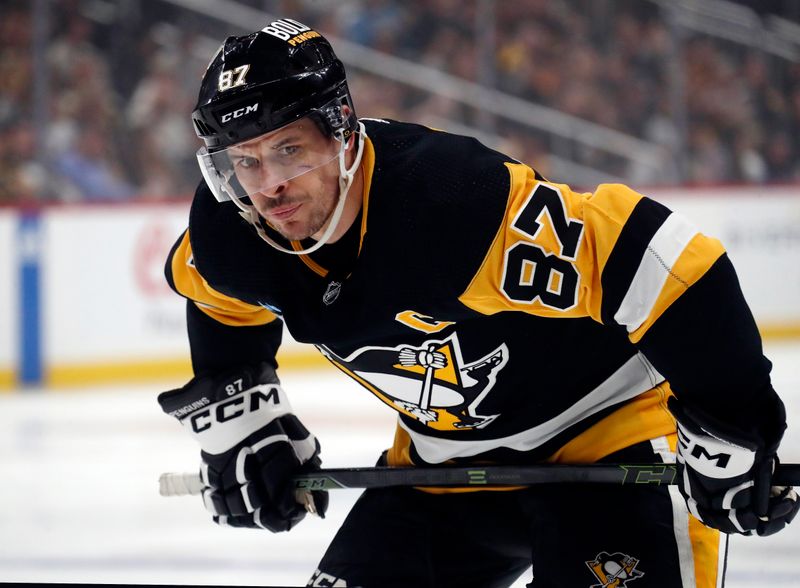 Jan 6, 2024; Pittsburgh, Pennsylvania, USA;  Pittsburgh Penguins center Sidney Crosby (87) prepares for a face-off against the Buffalo Sabres during the first period at PPG Paints Arena. Mandatory Credit: Charles LeClaire-USA TODAY Sports