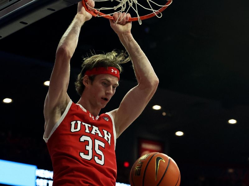 Jan 6, 2024; Tucson, Arizona, USA; Utah Utes center Branden Carlson (35) dunks the ball against Arizona Wildcats forward Keshad Johnson (16) during the first half at McKale Center. Mandatory Credit: Zachary BonDurant-USA TODAY Sports