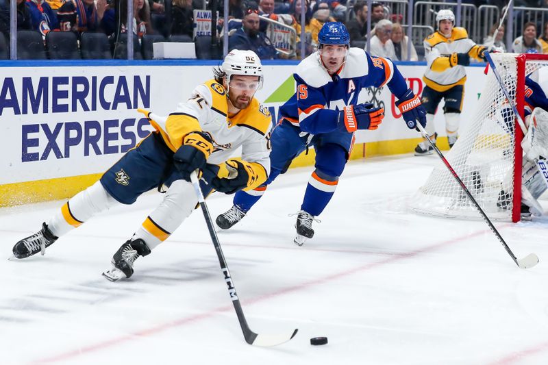 Apr 6, 2024; Elmont, New York, USA; Nashville Predators center Tommy Novak (82) skates the puck past New York Islanders right wing Cal Clutterbuck (15) during the third period at UBS Arena. Mandatory Credit: Tom Horak-USA TODAY Sports