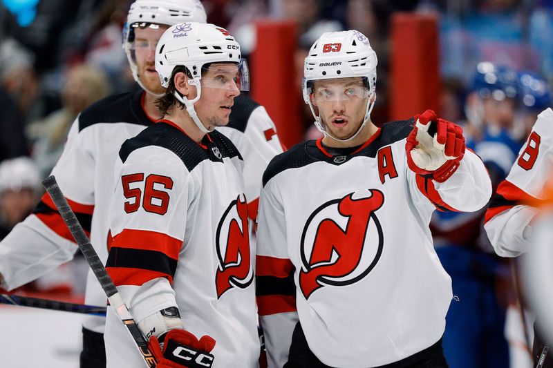 Nov 7, 2023; Denver, Colorado, USA; New Jersey Devils left wing Jesper Bratt (63) talks with left wing Erik Haula (56) in the third period against the Colorado Avalanche at Ball Arena. Mandatory Credit: Isaiah J. Downing-USA TODAY Sports