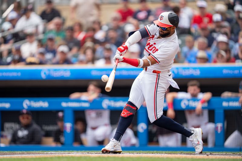 Jul 21, 2024; Minneapolis, Minnesota, USA; Minnesota Twins shortstop Willi Castro (50) connects, tries for a triple and is tagged out by Milwaukee Brewers third base Joey Ortiz (3) in the first inning at Target Field. Mandatory Credit: Matt Blewett-USA TODAY Sports