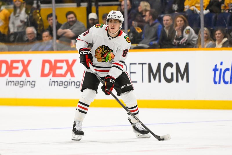 Jan 16, 2025; Nashville, Tennessee, USA;  Chicago Blackhawks center Teuvo Teravainen (86) skates with the puck against the Nashville Predators during the second period at Bridgestone Arena. Mandatory Credit: Steve Roberts-Imagn Images