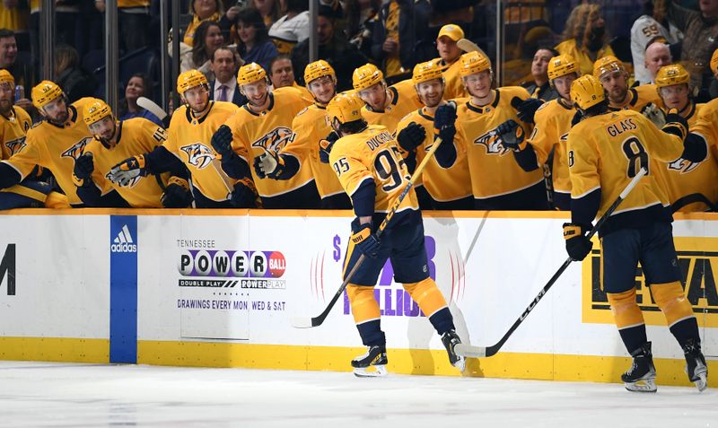 Jan 21, 2023; Nashville, Tennessee, USA; Nashville Predators center Matt Duchene (95) celebrates with teammates after a goal during the first period against the Los Angeles Kings at Bridgestone Arena. Mandatory Credit: Christopher Hanewinckel-USA TODAY Sports