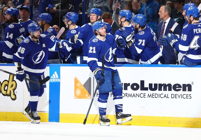 Feb 9, 2023; Tampa, Florida, USA; Tampa Bay Lightning center Brayden Point (21) celebrates with teammates after he scored a goal against the Colorado Avalanche during the second period at Amalie Arena. Mandatory Credit: Kim Klement-USA TODAY Sports