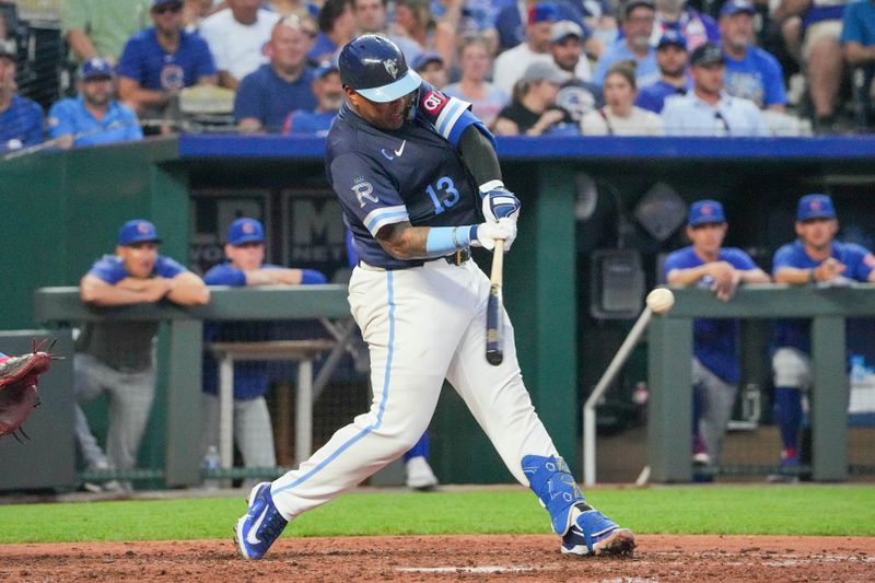 Jul 26, 2024; Kansas City, Missouri, USA;  Kansas City Royals catcher Salvador Perez (13) hits a three run home run against the Chicago Cubsin the sixth inning at Kauffman Stadium. Mandatory Credit: Denny Medley-USA TODAY Sports