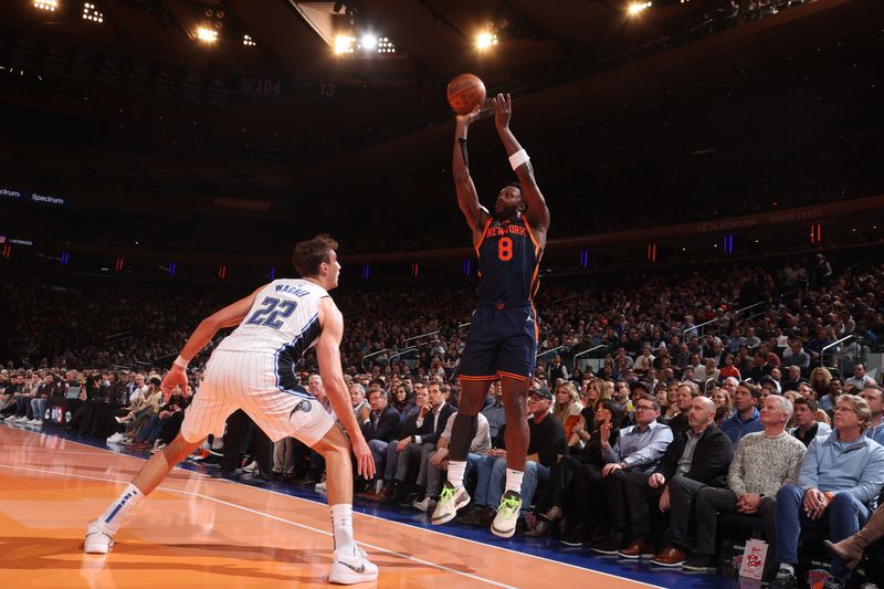 NEW YORK, NY - DECEMBER 3: OG Anunoby #8 of the New York Knicks shoots a three point basket during the game  against the Orlando Magic during the Emirates NBA Cup on December 3, 2024 at Madison Square Garden in New York City, New York.  NOTE TO USER: User expressly acknowledges and agrees that, by downloading and or using this photograph, User is consenting to the terms and conditions of the Getty Images License Agreement. Mandatory Copyright Notice: Copyright 2024 NBAE  (Photo by Nathaniel S. Butler/NBAE via Getty Images)