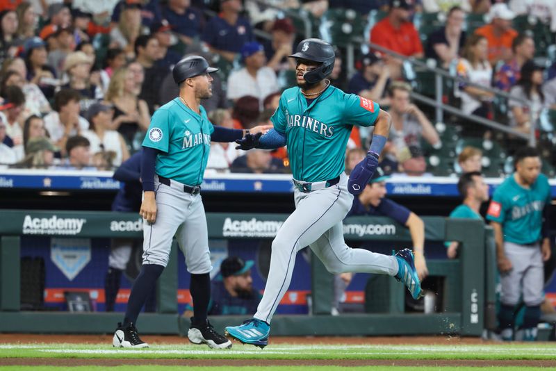 May 25, 2025; Houston, Texas, USA; Seattle Mariners center fielder Julio Rodriguez (44) rounds third base and scores a run during the first inning against the Houston Astros at Daikin Park. Mandatory Credit: Troy Taormina-Imagn Images