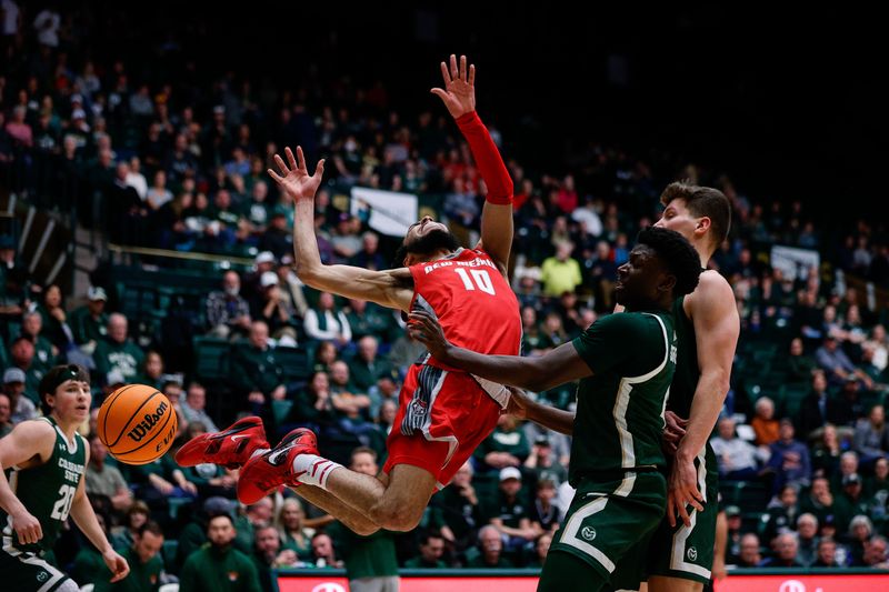 Mar 3, 2023; Fort Collins, Colorado, USA; New Mexico Lobos guard Jaelen House (10) reacts as Colorado State Rams guard Isaiah Stevens (4) knocks the ball away as forward Patrick Cartier (12) defends in the first half at Moby Arena. Mandatory Credit: Isaiah J. Downing-USA TODAY Sports