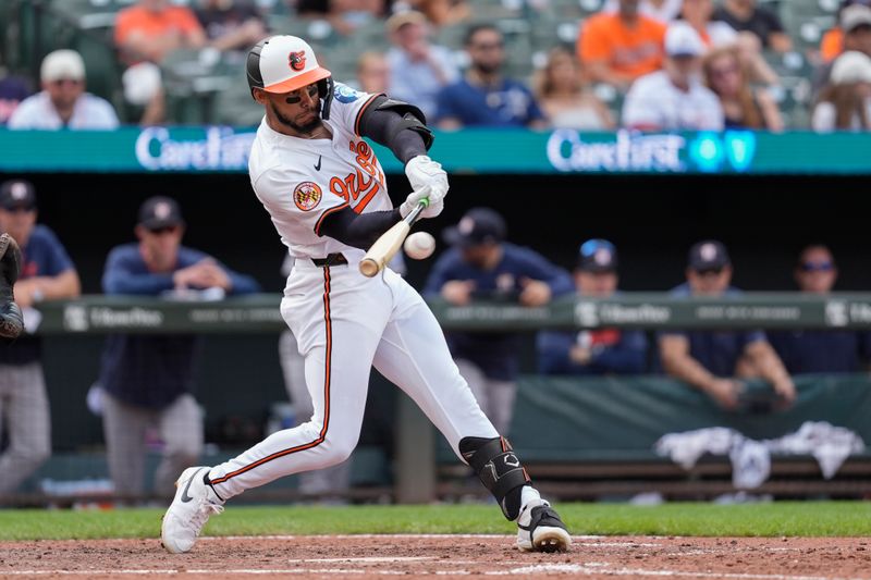 Aug 24, 2025; Baltimore, Maryland, USA; Baltimore Orioles right fielder Jeremiah Jackson (82) hits a single against the Houston Astros during the eighth inning at Oriole Park at Camden Yards. Mandatory Credit: Gregory Fisher-Imagn Images