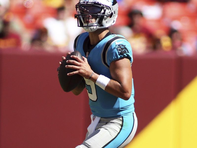 Carolina Panthers quarterback Matt Corral (9) throws during an NFL football game against the Washington Commanders, Saturday, Aug. 13, 2022 in Landover. (AP Photo/Daniel Kucin Jr.)