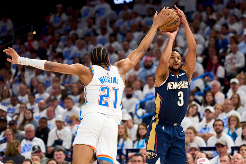 OKLAHOMA CITY, OKLAHOMA - APRIL 21: CJ McCollum #3 of the New Orleans Pelicans shoots the ball against Aaron Wiggins #21 of the Oklahoma City Thunder during the second half in game one of the Western Conference First Round Playoffs at the Paycom Center on April 21, 2024 in Oklahoma City, Oklahoma. NOTE TO USER: User expressly acknowledges and agrees that, by downloading and or using this photograph, User is consenting to the terms and conditions of the Getty Images License Agreement. (Photo by Cooper Neill/Getty Images)