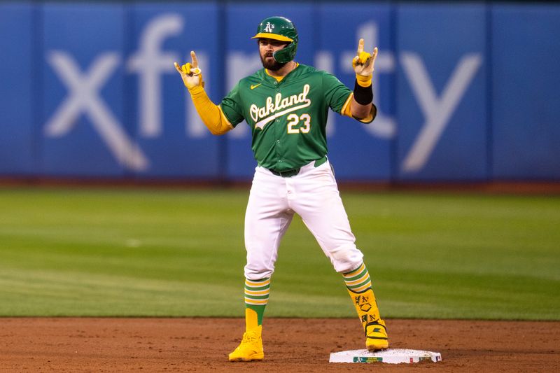 Sep 24, 2024; Oakland, California, USA; Oakland Athletics catcher Shea Langeliers (23) celebrates after hitting a RBI double against the Texas Rangers during the first inning at Oakland-Alameda County Coliseum. Mandatory Credit: Neville E. Guard-Imagn Images