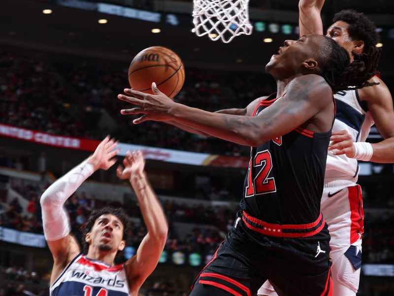 CHICAGO, IL - MARCH 25:  Ayo Dosunmu #12 of the Chicago Bulls shoots the ball during the game against the Washington Wizards on March 25, 2024 at United Center in Chicago, Illinois. NOTE TO USER: User expressly acknowledges and agrees that, by downloading and or using this photograph, User is consenting to the terms and conditions of the Getty Images License Agreement. Mandatory Copyright Notice: Copyright 2024 NBAE (Photo by Jeff Haynes/NBAE via Getty Images)