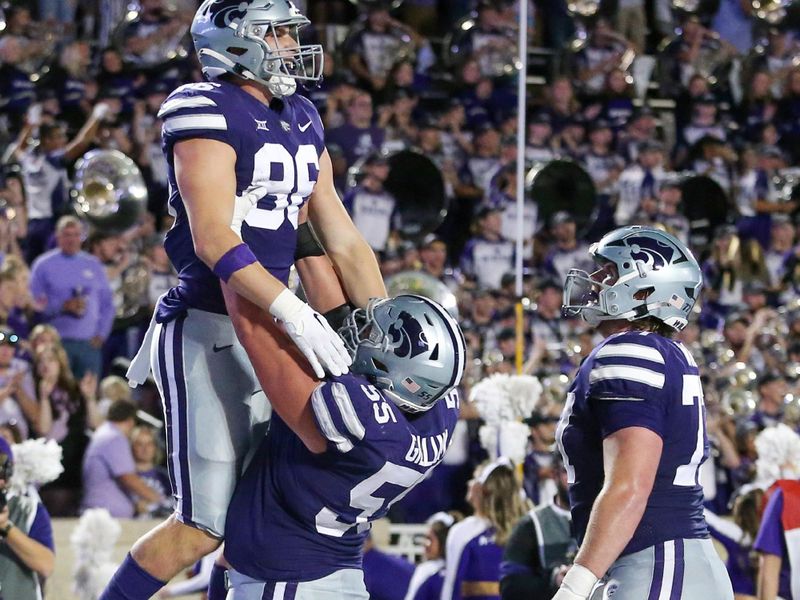 Oct 21, 2023; Manhattan, Kansas, USA; Kansas State Wildcats tight end Garrett Oakley (86) is congratulated by offensive lineman Hayden Gillum (55) after scoring a touchdown in the second quarter against the TCU Horned Frogs at Bill Snyder Family Football Stadium. The touchdown was called back on a holding penalty. Mandatory Credit: Scott Sewell-USA TODAY Sports