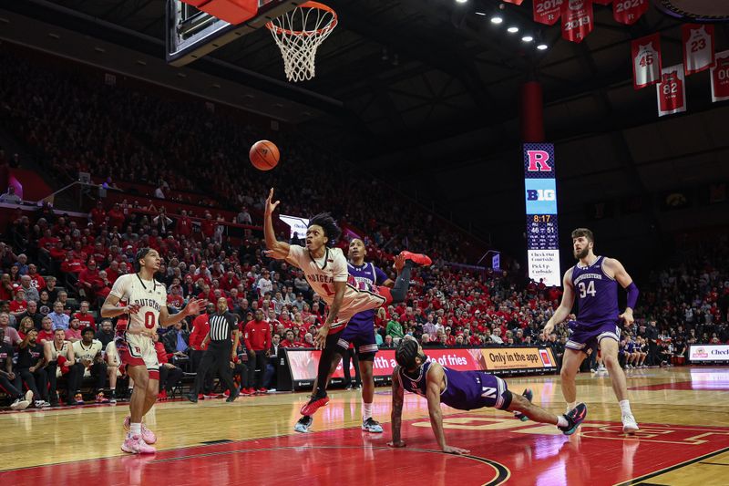 Feb 15, 2024; Piscataway, New Jersey, USA; Rutgers Scarlet Knights guard Jamichael Davis (1) drives for a shot against Northwestern Wildcats guard Boo Buie (0) and guard Justin Mullins (20) and center Matthew Nicholson (34) during the second half in front of guard Derek Simpson (0) at Jersey Mike's Arena. Mandatory Credit: Vincent Carchietta-USA TODAY Sports