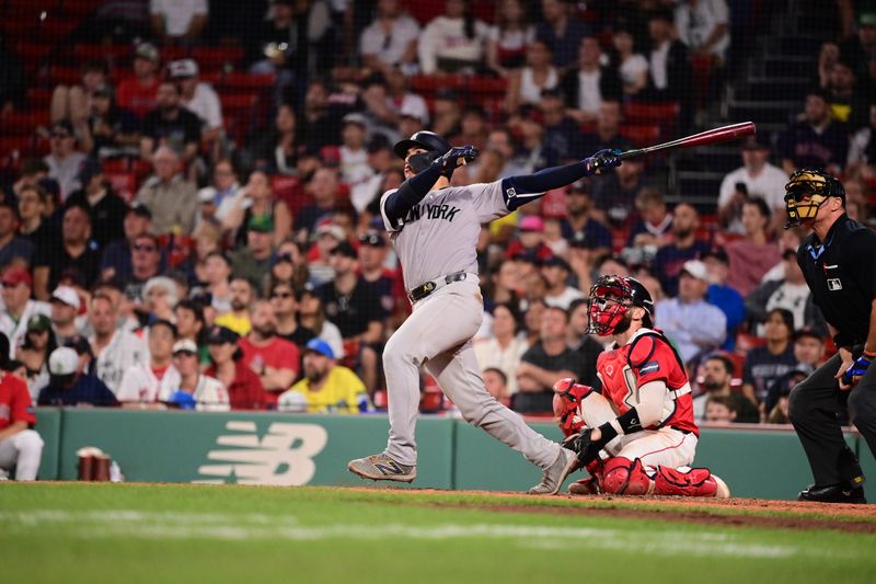 Jun 14, 2024; Boston, Massachusetts, USA; New York Yankees catcher Jose Trevino (39) hits a home run against the Boston Red Sox during the ninth inning at Fenway Park. Mandatory Credit: Eric Canha-USA TODAY Sports