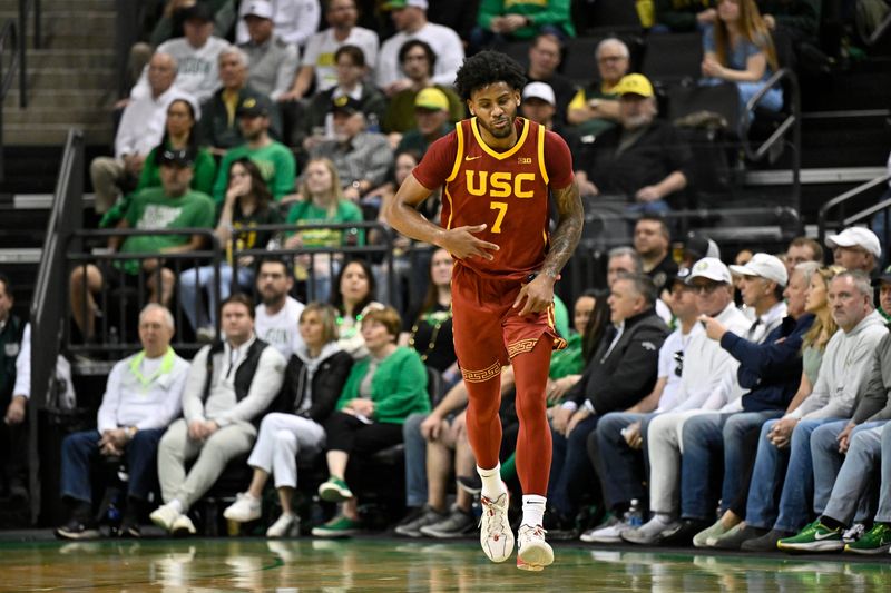 Mar 1, 2025; Eugene, Oregon, USA; USC Trojans guard Chibuzo Agbo (7) reacts to a three point shot in the first half against the Oregon Ducks at Matthew Knight Arena. Mandatory Credit: Craig Strobeck-Imagn Images