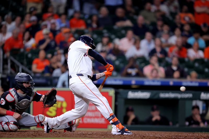 Apr 30, 2024; Houston, Texas, USA; Houston Astros catcher Victor Caratini (17) hits a walkoff home run against the Cleveland Guardians during the tenth inning at Minute Maid Park. Mandatory Credit: Erik Williams-USA TODAY Sports