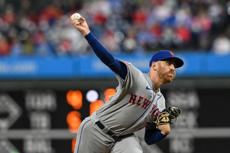 Sep 23, 2023; Philadelphia, Pennsylvania, USA;  New York Mets relief pitcher Reed Garrett (75) biting in the eighth inning against the Philadelphia Phillies at Citizens Bank Park. Philadelphia won 7-5. Mandatory Credit: John Geliebter-USA TODAY Sports