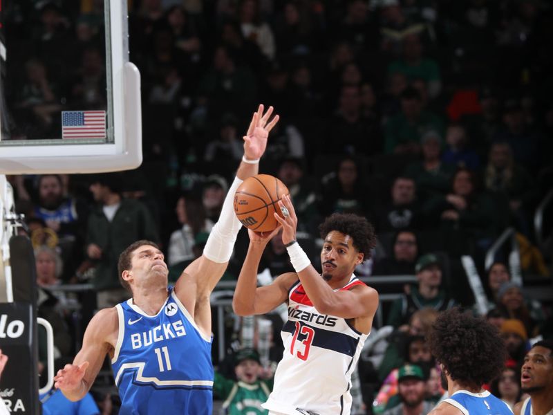 MILWAUKEE, WI - NOVEMBER 30: Jordan Poole #13 of the Washington Wizards passes the ball during the game against the Milwaukee Bucks on November 30, 2024 at Fiserv Forum Center in Milwaukee, Wisconsin. NOTE TO USER: User expressly acknowledges and agrees that, by downloading and or using this Photograph, user is consenting to the terms and conditions of the Getty Images License Agreement. Mandatory Copyright Notice: Copyright 2024 NBAE (Photo by Gary Dineen/NBAE via Getty Images).