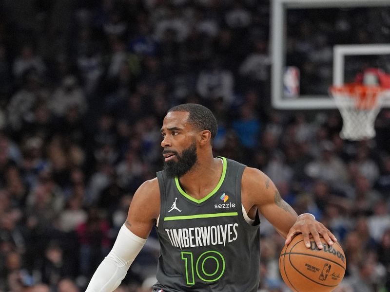 MINNEAPOLIS, MN - NOVEMBER 1: Mike Conley #10 of the Minnesota Timberwolves dribbles the ball during the game against the Denver Nuggets on November 1, 2024 at Target Center in Minneapolis, Minnesota. NOTE TO USER: User expressly acknowledges and agrees that, by downloading and or using this Photograph, user is consenting to the terms and conditions of the Getty Images License Agreement. Mandatory Copyright Notice: Copyright 2024 NBAE (Photo by Jordan Johnson/NBAE via Getty Images)