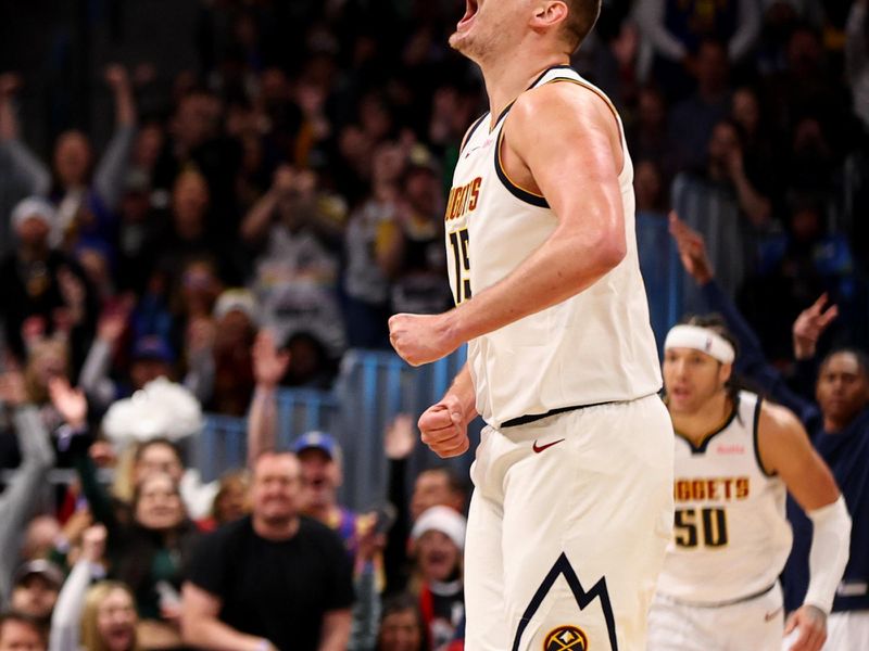 DENVER, COLORADO - DECEMBER 25: Nikola Jokic #15 of the Denver Nuggets reacts to a play against the Golden State Warriors at Ball Arena on December 25, 2023 in Denver, Colorado. NOTE TO USER: User expressly acknowledges and agrees that, by downloading and/or using this Photograph, user is consenting to the terms and conditions of the Getty Images License Agreement. (Photo by Jamie Schwaberow/Getty Images)