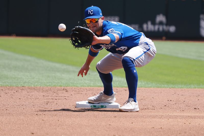 Aug 23, 2023; Oakland, California, USA; Kansas City Royals second baseman Michael Massey (19) catches the ball against the Oakland Athletics during the first inning at Oakland-Alameda County Coliseum. Mandatory Credit: Kelley L Cox-USA TODAY Sports