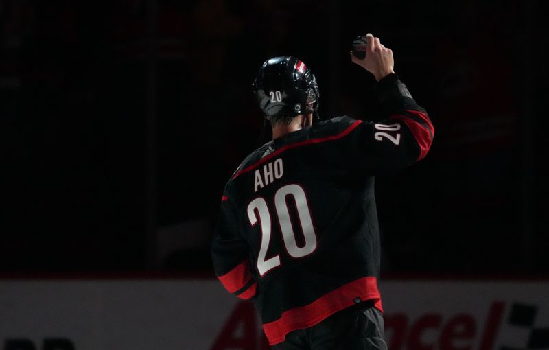 Apr 5, 2024; Raleigh, North Carolina, USA; Carolina Hurricanes center Sebastian Aho (20) celebrates after their victory against the Washington Capitals at PNC Arena. Mandatory Credit: James Guillory-USA TODAY Sports