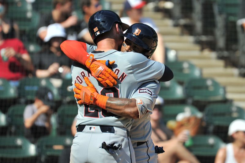 Aug 25, 2024; Chicago, Illinois, USA; Detroit Tigers second base Andy Ibanez (77) celebrates his two-run home run with first base Spencer Torkelson (20) during the seventh inning against the Chicago White Sox at Guaranteed Rate Field. Mandatory Credit: Patrick Gorski-USA TODAY Sports