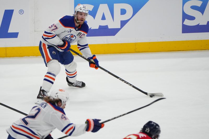 Jun 9, 2025; Sunrise, Florida, USA; Edmonton Oilers defenseman Evan Bouchard (2) controls the puck during the first period against the Florida Panthers in game three of the 2025 Stanley Cup Final at Amerant Bank Arena. Mandatory Credit: Sam Navarro-Imagn Images