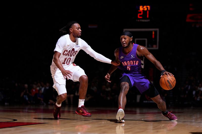 TORONTO, CANADA - OCTOBER 23: Immanuel Quickley #5 of the Toronto Raptors dribbles the ball during the game against the Cleveland Cavaliers on October 23, 2024 at the Scotiabank Arena in Toronto, Ontario, Canada.  NOTE TO USER: User expressly acknowledges and agrees that, by downloading and or using this Photograph, user is consenting to the terms and conditions of the Getty Images License Agreement.  Mandatory Copyright Notice: Copyright 2024 NBAE (Photo by Mark Blinch/NBAE via Getty Images)