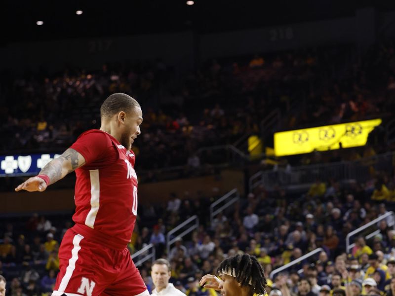 Mar 10, 2024; Ann Arbor, Michigan, USA;  mo is defended by Nebraska Cornhuskers guard C.J. Wilcher (0) in the first half at Crisler Center. Mandatory Credit: Rick Osentoski-USA TODAY Sports