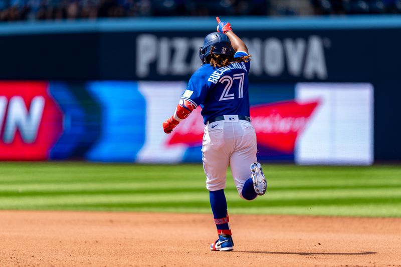 Jul 20, 2023; Toronto, Ontario, CAN; Toronto Blue Jays first baseman Vladimir Guerrero Jr. (27) hits a home run against the San Diego Padres during the seventh inning at Rogers Centre. Mandatory Credit: Kevin Sousa-USA TODAY Sports