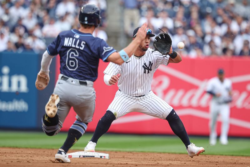 May 4, 2025; Bronx, New York, USA; New York Yankees third baseman Oswald Peraza (18) forces out Tampa Bay Rays shortstop Taylor Walls (6) ate second base during the second inning at Yankee Stadium. Mandatory Credit: Vincent Carchietta-Imagn Images