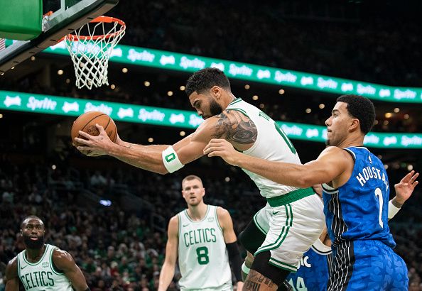 Boston, MA - December 17: Boston Celtics SF Jayson Tatum grabs a loose ball in the third quarter. The Celtics beat the Orlando Magic, 114-97. (Photo by Tanner Pearson/The Boston Globe via Getty Images)