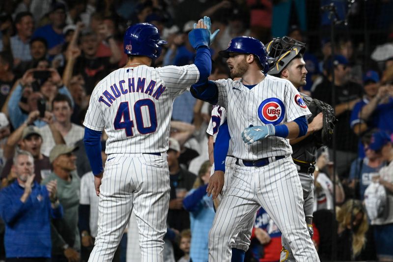 Sep 20, 2023; Chicago, Illinois, USA; Chicago Cubs left fielder Ian Happ (8), right, celebrates his grand slam against the Pittsburgh Pirates with Chicago Cubs center fielder Mike Tauchman (40) during the fifth inning at Wrigley Field. Mandatory Credit: Matt Marton-USA TODAY Sports