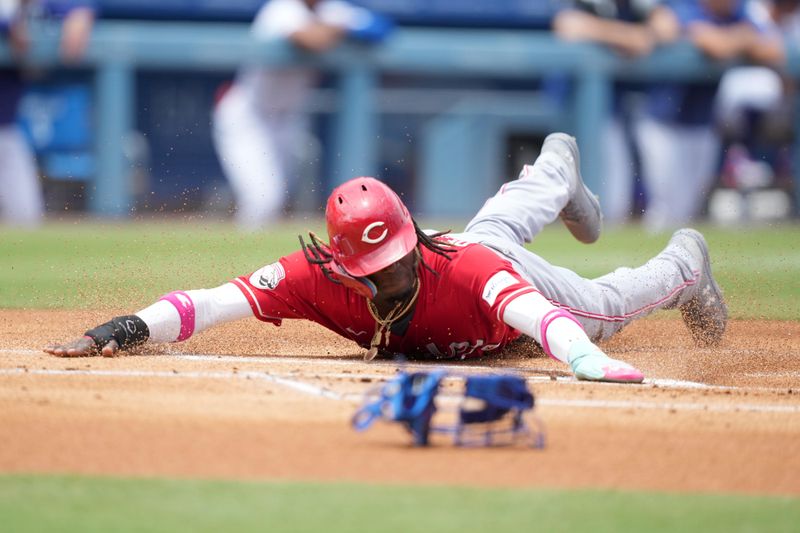 Jul 30, 2023; Los Angeles, California, USA; Cincinnati Reds third baseman Elly De La Cruz (44) slides into home plate to score in the first inning against the Los Angeles Dodgers at Dodger Stadium. Mandatory Credit: Kirby Lee-USA TODAY Sports