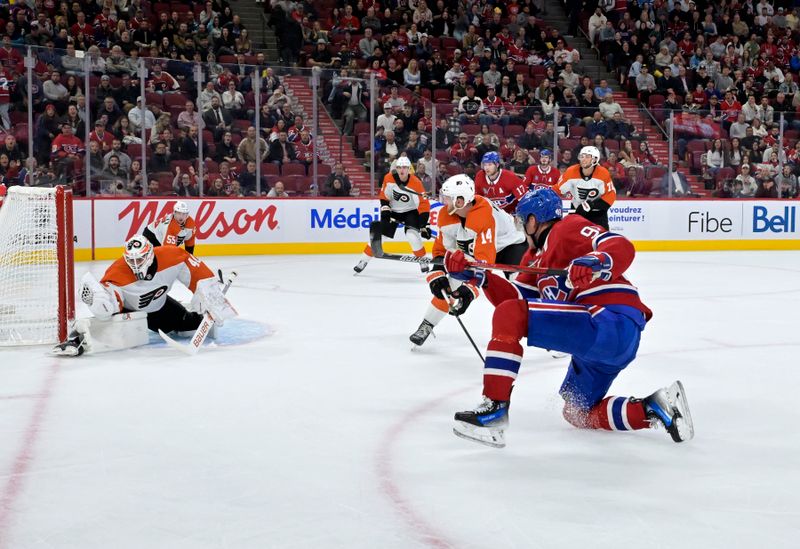 Sep 23, 2024; Montreal, Quebec, CAN; Philadelphia Flyers goalie Cal Petersen (40) makes a save against Montreal Canadiens forward Patrik Laine (92) during the second period at the Bell Centre. Mandatory Credit: Eric Bolte-Imagn Images