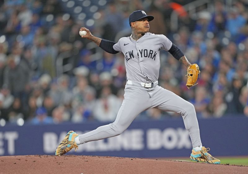 Apr 17, 2024; Toronto, Ontario, CAN; New York Yankees starting pitcher Marcus Stroman (0) throws a pitch against the Toronto Blue Jays during the first inning at Rogers Centre. Mandatory Credit: Nick Turchiaro-USA TODAY Sports