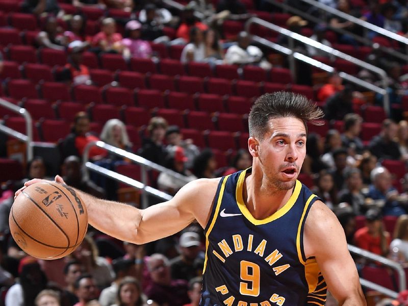 HOUSTON, TX - OCTOBER 10: T.J. McConnell #9 of the Indiana Pacers drives to the hoop during the game against the Houston Rockets on October 10, 2023 at the Toyota Center in Houston, TX. NOTE TO USER: User expressly acknowledges and agrees that, by downloading and or using this photograph, User is consenting to the terms and conditions of the Getty Images License Agreement. Mandatory Copyright Notice: Copyright 2023 NBAE (Photo by Logan Riely/NBAE via Getty Images)