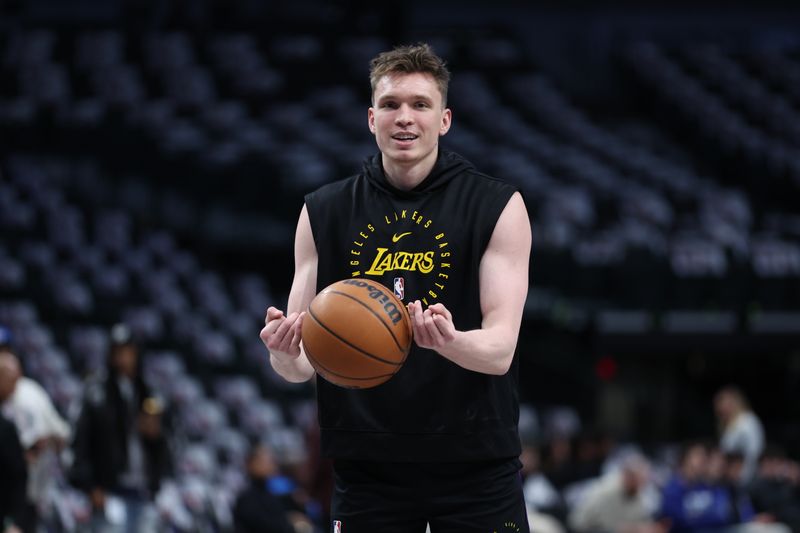 DALLAS, TX - JANUARY 7: Dalton Knecht #4 of the Los Angeles Lakers warms up before the game against the Dallas Mavericks on January 7, 2025 at American Airlines Center in Dallas, Texas. NOTE TO USER: User expressly acknowledges and agrees that, by downloading and or using this photograph, User is consenting to the terms and conditions of the Getty Images License Agreement. Mandatory Copyright Notice: Copyright 2025 NBAE (Photo by Tim Heitman/NBAE via Getty Images)