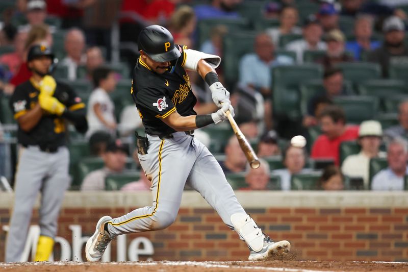 Jun 28, 2024; Atlanta, Georgia, USA; Pittsburgh Pirates second baseman Nick Gonzales (39) hits a ground-rule double against the Atlanta Braves in the seventh inning at Truist Park. Mandatory Credit: Brett Davis-USA TODAY Sports