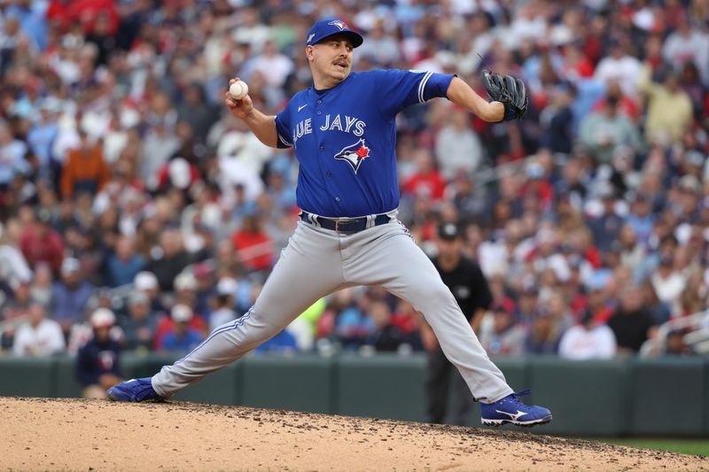 Oct 4, 2023; Minneapolis, Minnesota, USA; Toronto Blue Jays relief pitcher Erik Swanson (50) delivers pitch in the seventh inning against the Minnesota Twins during game two of the Wildcard series for the 2023 MLB playoffs at Target Field. Mandatory Credit: Jesse Johnson-USA TODAY Sports